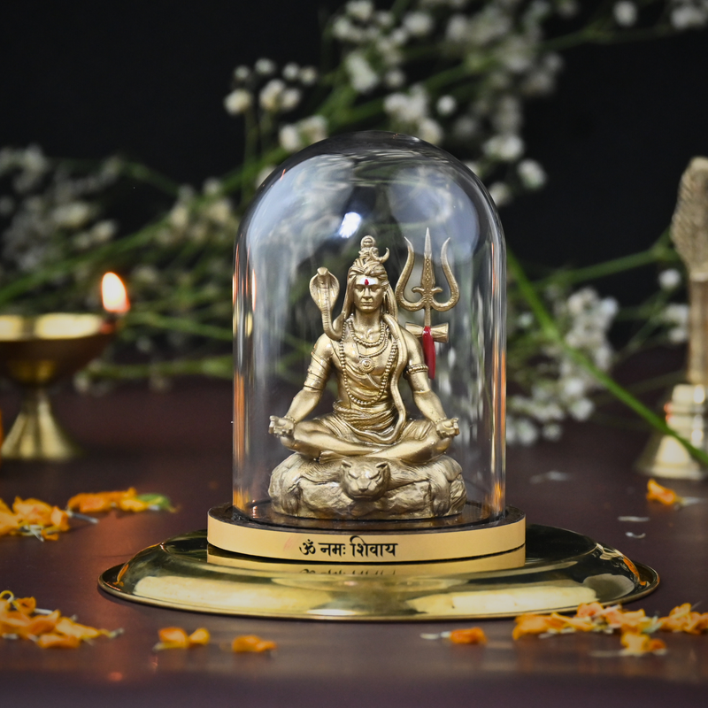 Tapasvi Shiv Ji idol in glass dome — golden meditating Mahadev murti on Om Namah Shivaya base