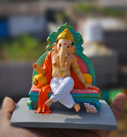 Ganesh ji sitting on sofa