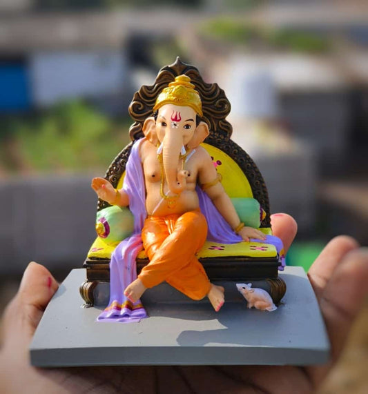 Ganesh ji sitting on sofa